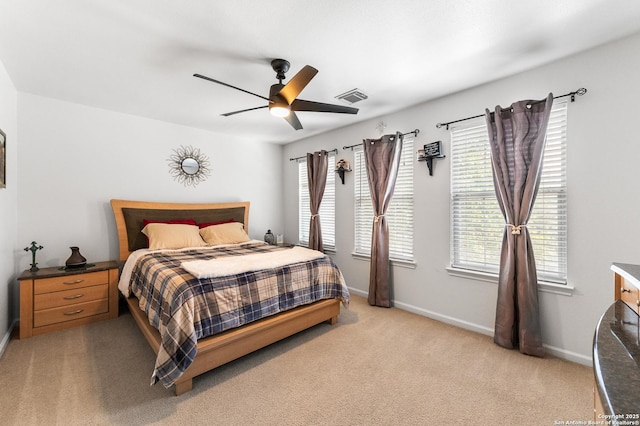 1623 Rainy Brk, Schertz, TX 78154 - bedroom featuring light carpet, multiple windows, baseboards, and ceiling fan