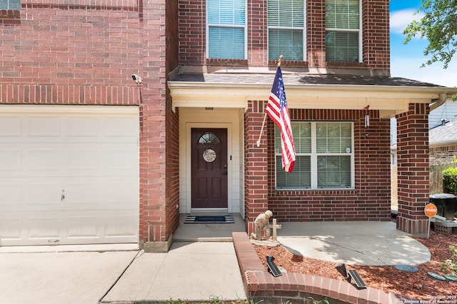 1623 Rainy Brk, Schertz, TX 78154 - view of exterior entry with brick siding, an attached garage, and driveway