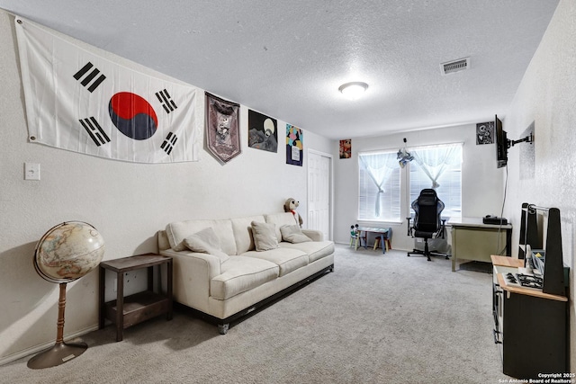 1515 Agency, San Antonio, TX 78245 - living room featuring carpet floors, a textured ceiling, and a desk