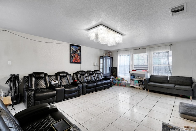 1515 Agency, San Antonio, TX 78245 - home theater featuring a chandelier, light tile patterned floors, and a textured ceiling