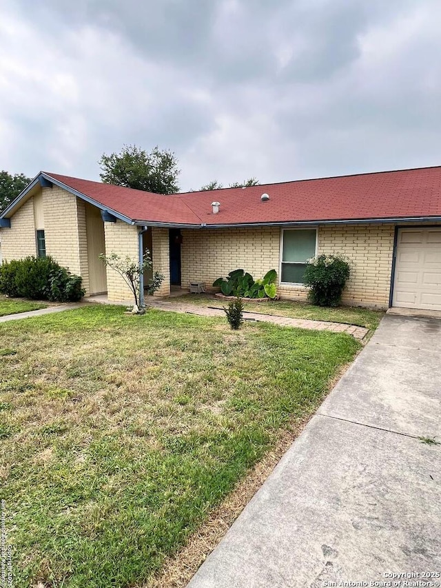 6014 White Cloud, San Antonio, TX 78238 - view of front of house with brick siding, a front lawn, and concrete driveway