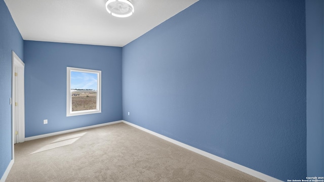 201 Lakeview Cir, La Vernia, TX 78121 - empty room with carpet floors and baseboards