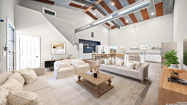 201 Lakeview Cir, La Vernia, TX 78121 - living area featuring high vaulted ceiling and beam ceiling