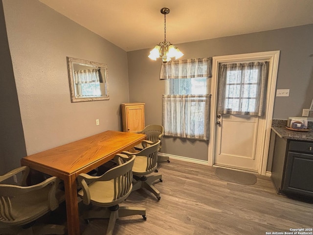 527 Artemis, San Antonio, TX 78218 - dining space featuring lofted ceiling, light wood-type flooring, a chandelier, baseboards, and a desk