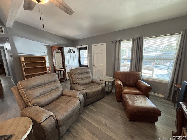 527 Artemis, San Antonio, TX 78218 - living room featuring lofted ceiling, wood finished floors, ceiling fan, and baseboards