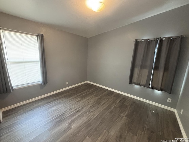 527 Artemis, San Antonio, TX 78218 - spare room with dark wood-type flooring and baseboards