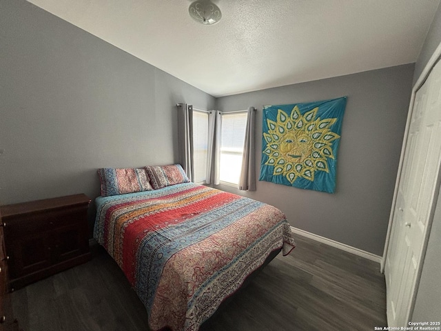 527 Artemis, San Antonio, TX 78218 - bedroom with dark wood-style flooring, baseboards, and a textured ceiling