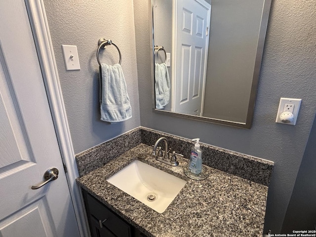 527 Artemis, San Antonio, TX 78218 - bathroom featuring vanity and a textured wall