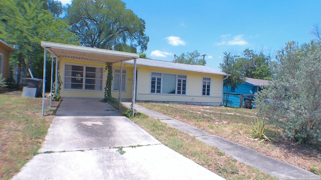 427 Olney, San Antonio, TX 78209 - view of front of home with concrete driveway and an attached carport