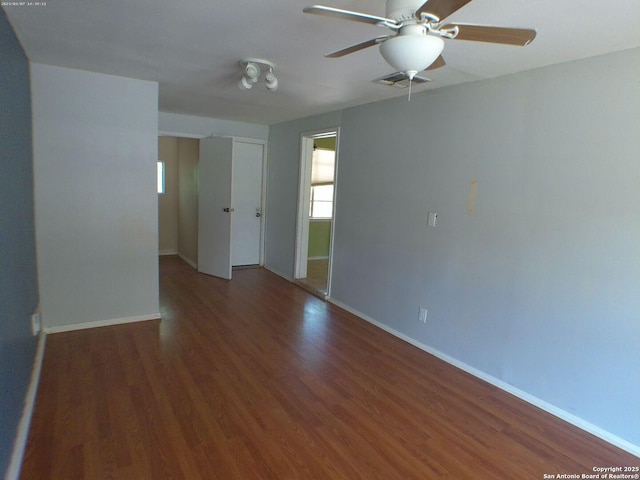 427 Olney, San Antonio, TX 78209 - empty room with wood finished floors, baseboards, and a ceiling fan