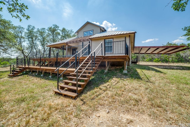 756 County Road 245, Hondo, TX 78861 - rear view of property featuring stairs, a deck, a lawn, and metal roof