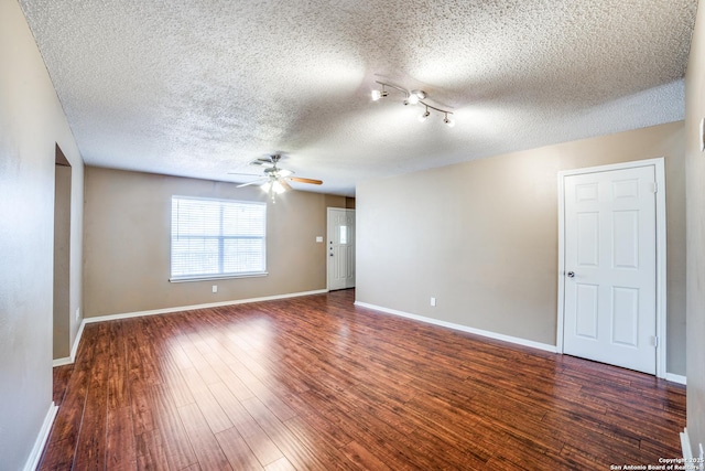 756 County Road 245, Hondo, TX 78861 - unfurnished room with ceiling fan, a textured ceiling, wood finished floors, and baseboards