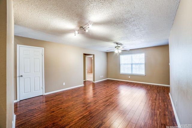 756 County Road 245, Hondo, TX 78861 - unfurnished room featuring ceiling fan, a textured ceiling, wood finished floors, and baseboards