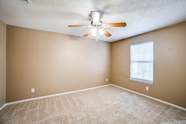 756 County Road 245, Hondo, TX 78861 - empty room with carpet floors, a ceiling fan, a textured ceiling, and baseboards