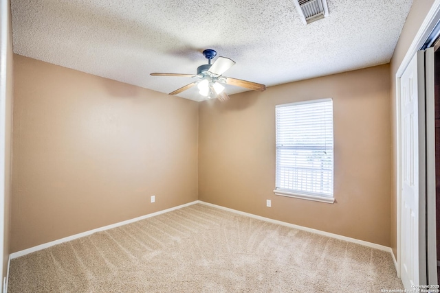 756 County Road 245, Hondo, TX 78861 - carpeted empty room with ceiling fan, baseboards, and a textured ceiling