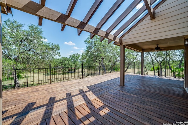 756 County Road 245, Hondo, TX 78861 - wooden deck featuring a ceiling fan and view of scattered trees
