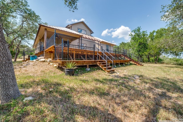 756 County Road 245, Hondo, TX 78861 - rear view of house with stairs, a wooden deck, and metal roof