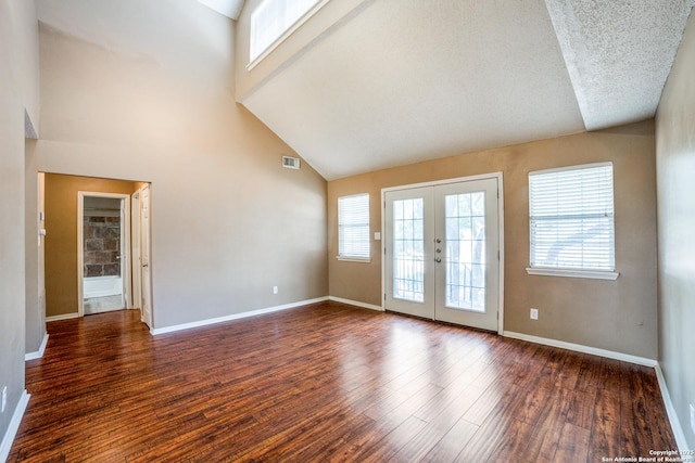 756 County Road 245, Hondo, TX 78861 - unfurnished room featuring french doors, wood finished floors, high vaulted ceiling, and baseboards