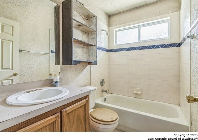 2514 Christian, San Antonio, TX 78222 - bathroom featuring vanity, toilet, and  shower combination