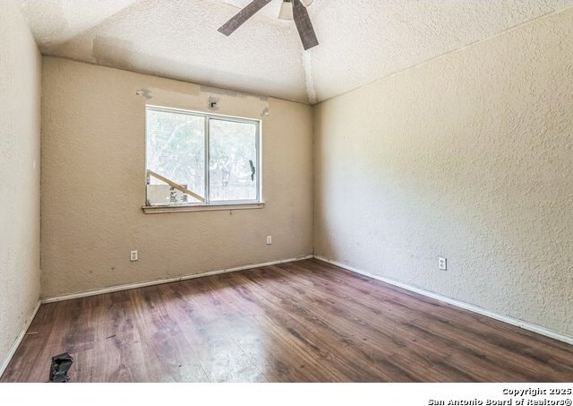 2514 Christian, San Antonio, TX 78222 - unfurnished room featuring wood finished floors, a textured wall, a ceiling fan, a textured ceiling, and baseboards