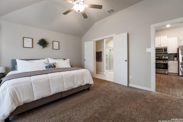 6955 Shiraz Way, Converse, TX 78109 - bedroom with stainless steel fridge with ice dispenser, lofted ceiling, carpet, connected bathroom, and baseboards