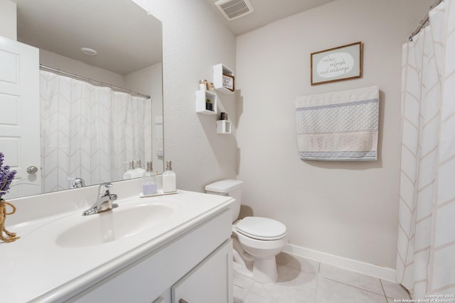 6955 Shiraz Way, Converse, TX 78109 - full bathroom featuring vanity, toilet, tile patterned flooring, and baseboards