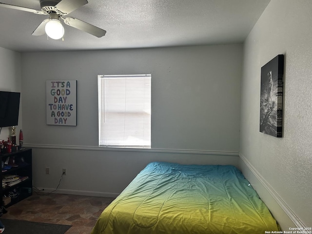 314 US Highway 57, La Pryor, TX 78872 - bedroom featuring a ceiling fan and baseboards
