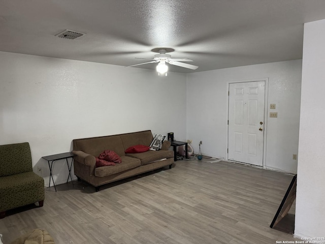 314 US Highway 57, La Pryor, TX 78872 - living area with wood finished floors and ceiling fan