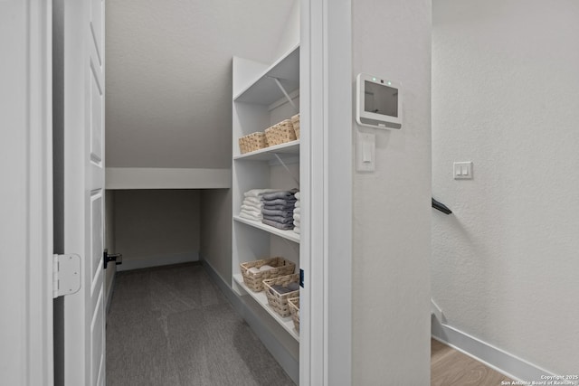 20675 Huebner Rd, San Antonio, TX 78258 - spacious closet featuring dark colored carpet