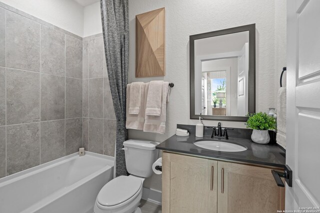 20675 Huebner Rd, San Antonio, TX 78258 - bathroom with toilet, vanity, and bathtub / shower combination