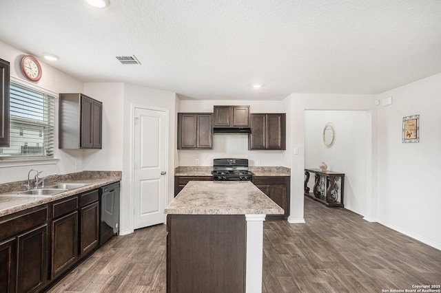 14506 Tundra Swan, San Antonio, TX 78253 - kitchen featuring black appliances, a sink, dark wood-style flooring, dark brown cabinets, and a kitchen island