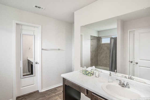 14506 Tundra Swan, San Antonio, TX 78253 - full bathroom with vanity, wood finished floors, baseboards, and shower / tub combo with curtain