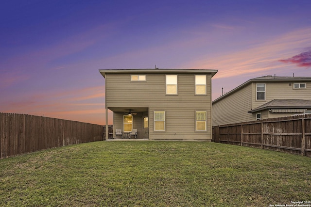14506 Tundra Swan, San Antonio, TX 78253 - back of property at dusk with ceiling fan and a patio area