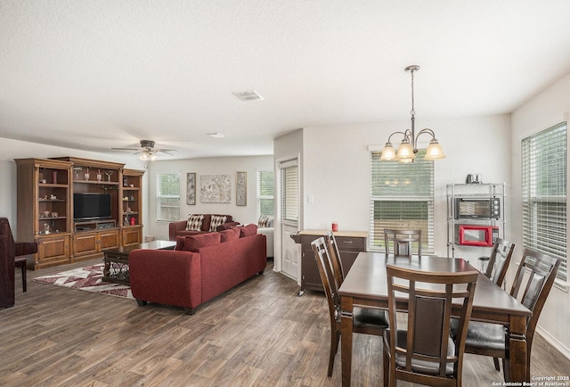 14506 Tundra Swan, San Antonio, TX 78253 - dining space featuring wood finished floors, a chandelier, and ceiling fan