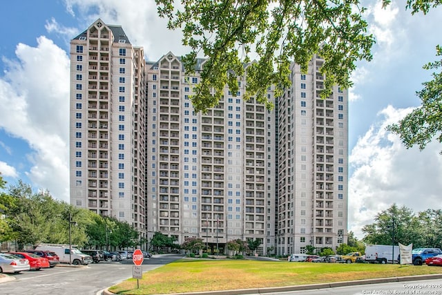 1 Towers Park Ln Unit 1512, San Antonio, TX 78209 - view of building exterior featuring uncovered parking