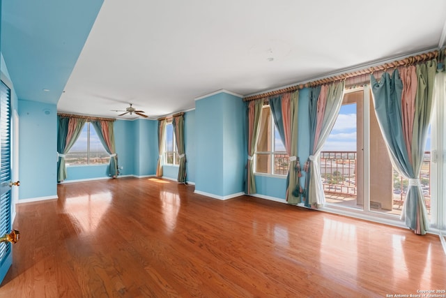 1 Towers Park Ln Unit 1512, San Antonio, TX 78209 - spare room with baseboards, wood finished floors, and a ceiling fan