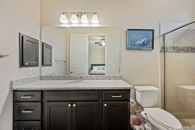 7938 Cibolo, Boerne, TX 78015 - bathroom featuring vanity, a stall shower, toilet, ensuite bath, and a ceiling fan
