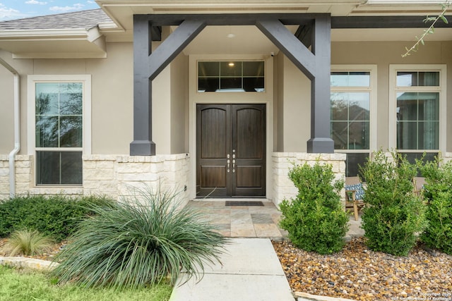 7938 Cibolo, Boerne, TX 78015 - doorway to property featuring stone siding, stucco siding, and roof with shingles
