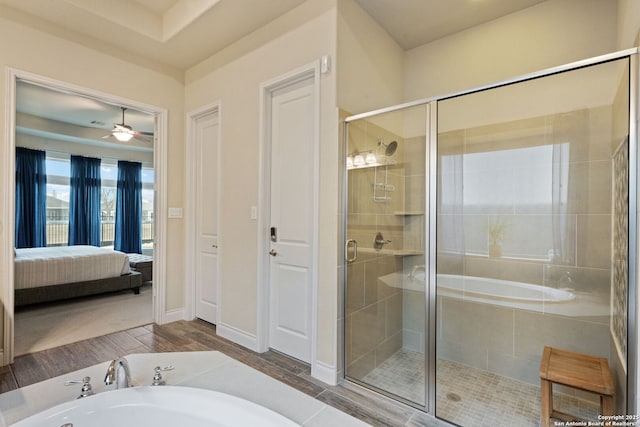 7938 Cibolo, Boerne, TX 78015 - bathroom with a garden tub, a shower stall, wood finished floors, and connected bathroom