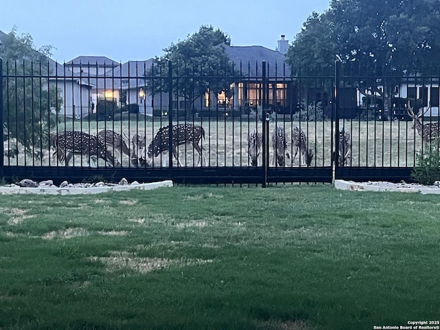 7938 Cibolo, Boerne, TX 78015 - gate featuring a lawn