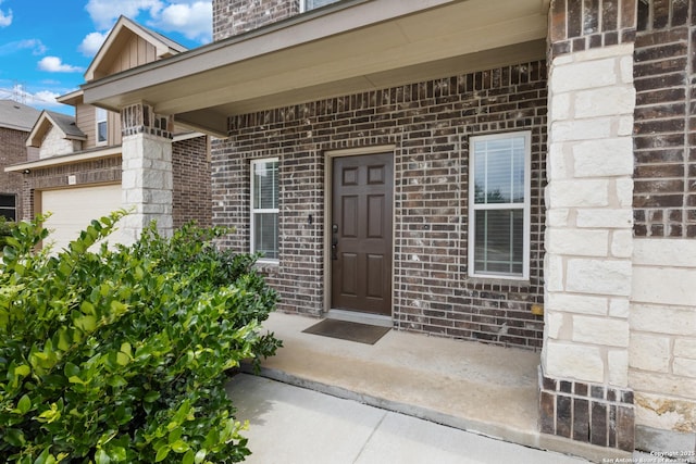 11423 Roadrunner, San Antonio, TX 78245 - property entrance with brick siding and a garage