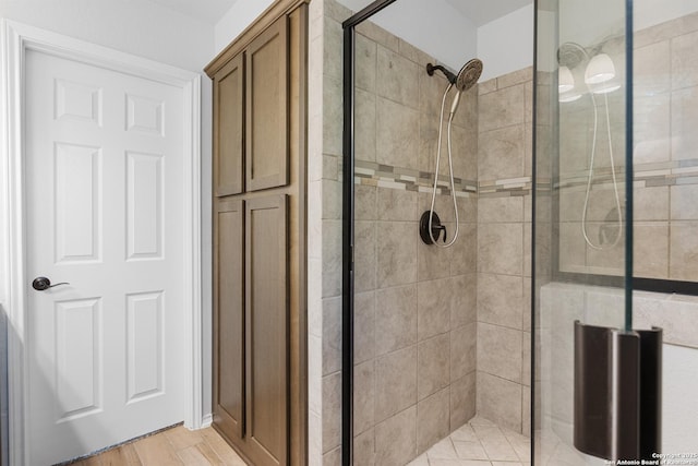 11423 Roadrunner, San Antonio, TX 78245 - full bath with a shower stall and wood finished floors