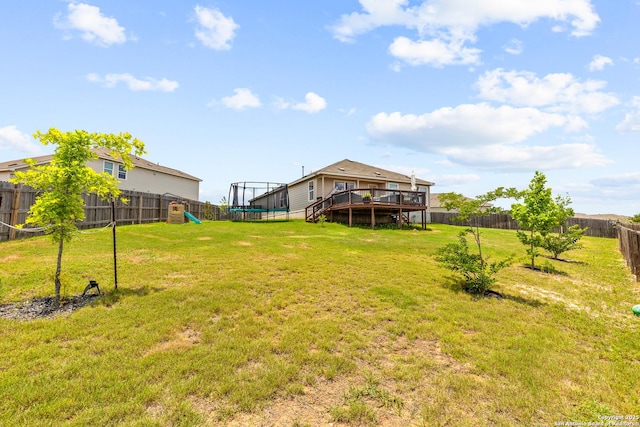 5481 Reverence, Bulverde, TX 78163 - view of yard featuring a wooden deck, a trampoline, and a playground