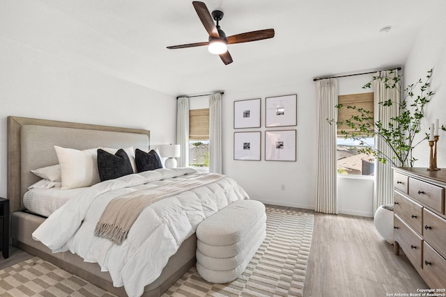 5481 Reverence, Bulverde, TX 78163 - bedroom with light wood-style flooring, a ceiling fan, and baseboards