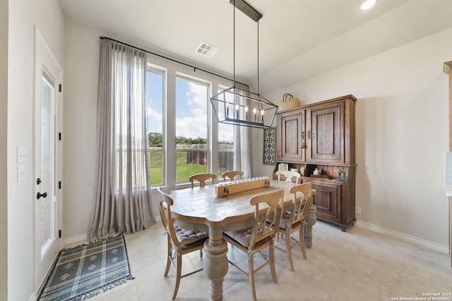 122 Indigo Bnd, Boerne, TX 78006 - dining room with baseboards, a chandelier, and light tile patterned flooring