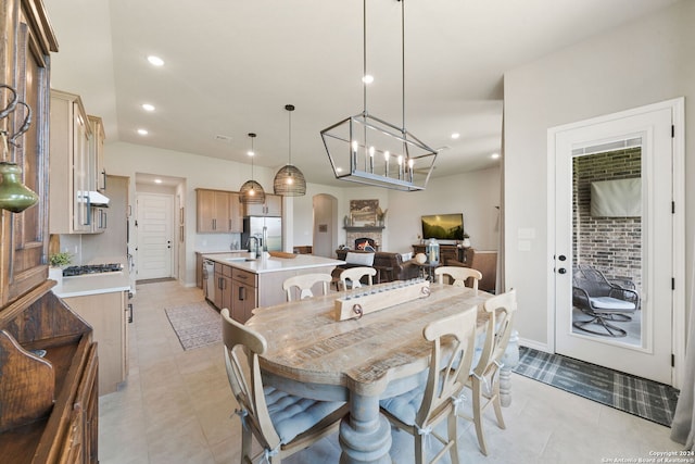 122 Indigo Bnd, Boerne, TX 78006 - dining space with arched walkways, recessed lighting, a chandelier, and light tile patterned flooring