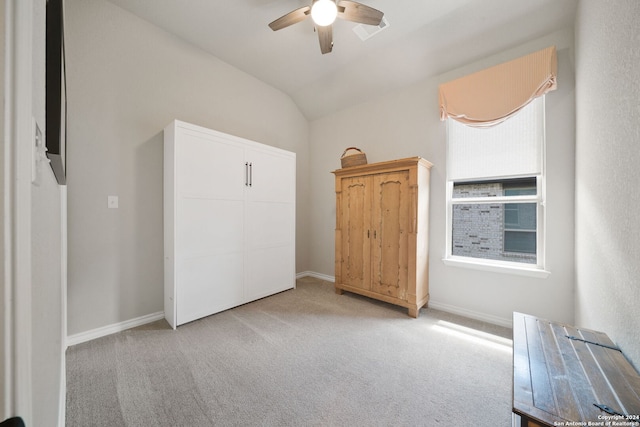 122 Indigo Bnd, Boerne, TX 78006 - bedroom featuring light carpet, baseboards, lofted ceiling, and ceiling fan