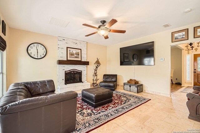 1802 Fallow Run, San Antonio, TX 78248 - living area with a ceiling fan, a fireplace, and baseboards