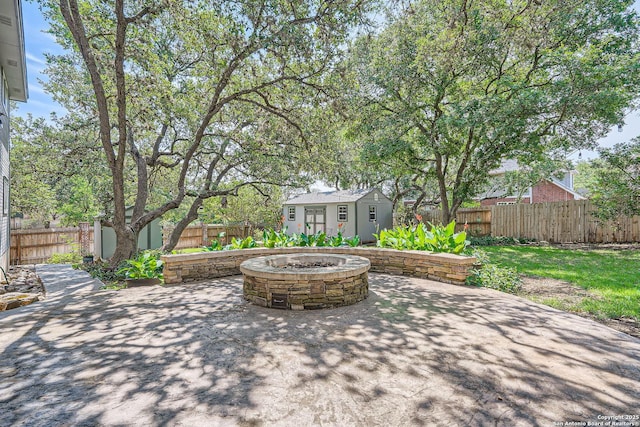 1802 Fallow Run, San Antonio, TX 78248 - fenced backyard with an outdoor fire pit and a patio area