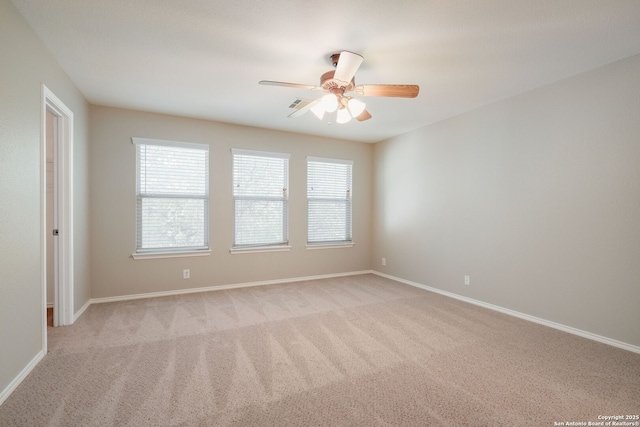 543 Willow Grove Dr, San Antonio, TX 78245 - empty room featuring light colored carpet, a ceiling fan, and baseboards